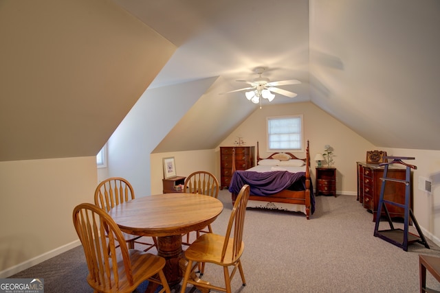 carpeted bedroom with vaulted ceiling and ceiling fan