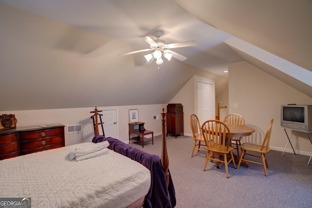 carpeted bedroom featuring ceiling fan and lofted ceiling