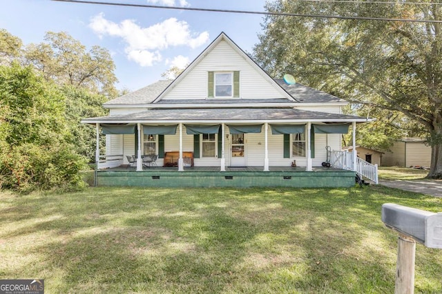 farmhouse with covered porch and a front lawn