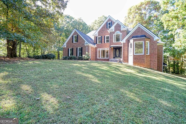 15 Greenridge Way, Newnan, GA 30265 - view of front of home featuring brick siding and a front lawn