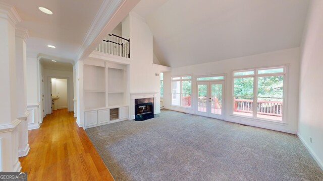 15 Greenridge Way, Newnan, GA 30265 - kitchen featuring light wood-style flooring, double oven, a notable chandelier, white cabinetry, and a wealth of natural light