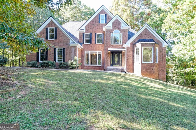 15 Greenridge Way, Newnan, GA 30265 - traditional-style house with brick siding and a front yard