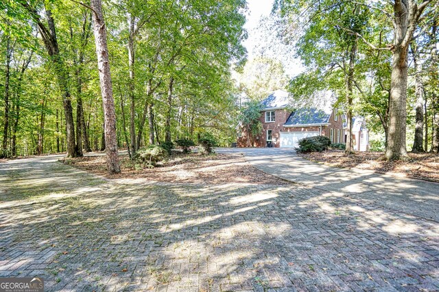 15 Greenridge Way, Newnan, GA 30265 - view of front of house with brick siding, driveway, and a garage