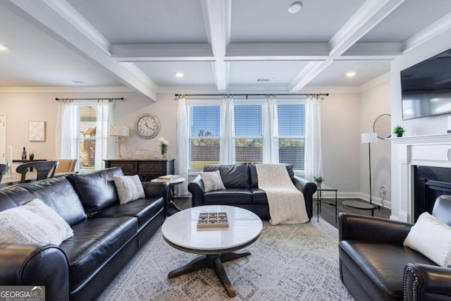 living room featuring hardwood / wood-style flooring, beam ceiling, crown molding, and coffered ceiling