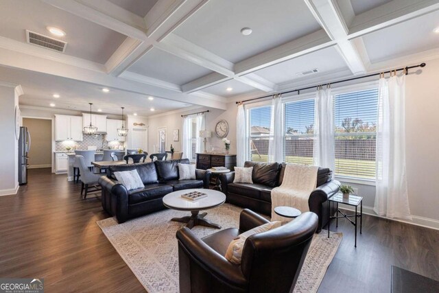 living room featuring beamed ceiling, dark hardwood / wood-style floors, crown molding, and coffered ceiling