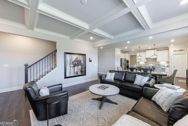 living room with dark hardwood / wood-style flooring, coffered ceiling, ornamental molding, and beam ceiling