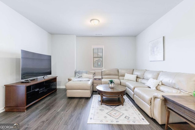 living room featuring dark wood-type flooring