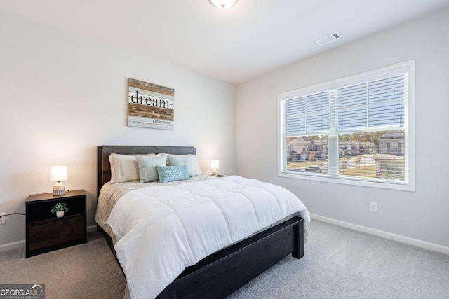 bedroom with light carpet