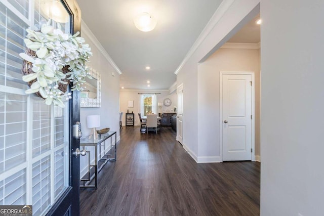 hall featuring dark hardwood / wood-style floors and crown molding