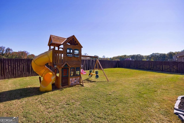 view of playground with a lawn