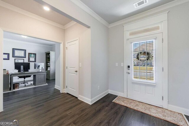 foyer with dark hardwood / wood-style flooring and ornamental molding