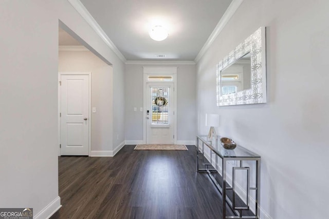 entrance foyer with dark hardwood / wood-style floors and crown molding