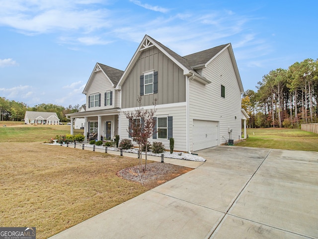 view of front of home with a garage and a front lawn