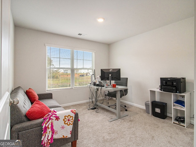 office space with light colored carpet