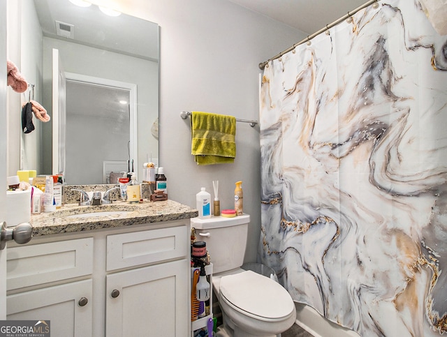 bathroom with vanity and toilet