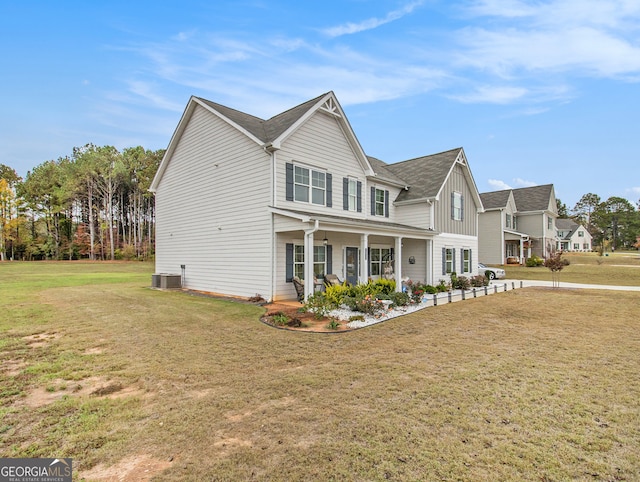 view of front facade with a front lawn and covered porch