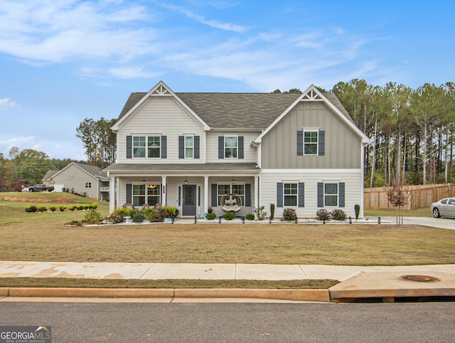 craftsman house featuring a porch and a front lawn