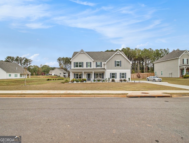 view of front facade with a porch and a front lawn