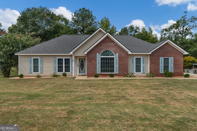 ranch-style house featuring a front lawn