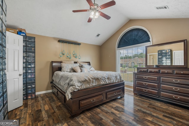 bedroom with lofted ceiling, ceiling fan, a textured ceiling, and dark hardwood / wood-style flooring