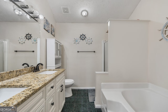 full bathroom featuring plus walk in shower, a textured ceiling, toilet, tile patterned floors, and vanity