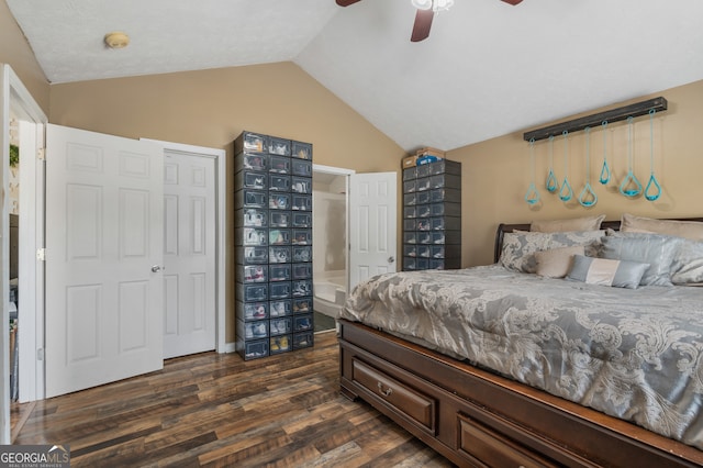 bedroom with a closet, dark wood-type flooring, lofted ceiling, and ceiling fan