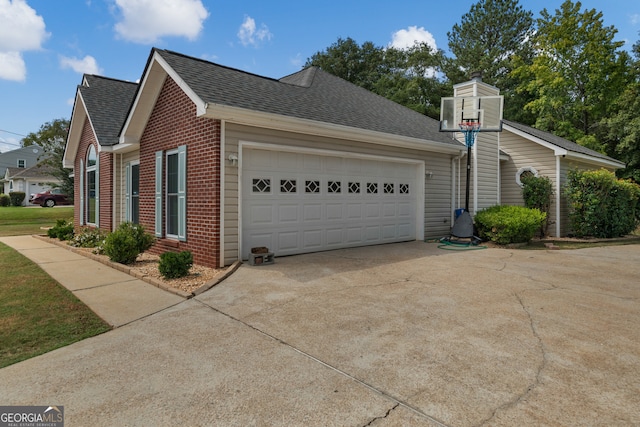 view of side of home with a garage