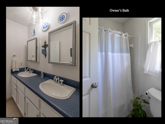 bathroom with toilet, curtained shower, vanity, and tile patterned flooring