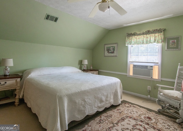 bedroom with ceiling fan, a textured ceiling, lofted ceiling, and carpet floors