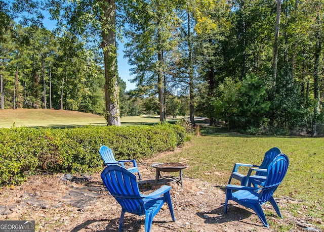 view of yard with a fire pit