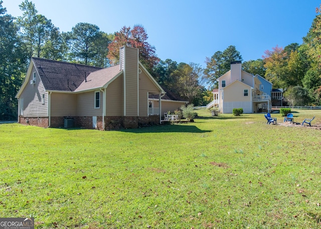 7 Stonehaven Dr, Newnan, GA 30265 - view of property exterior with a lawn, a chimney, central air condition unit, and stairway