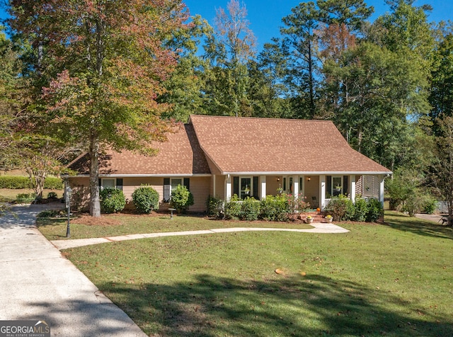 view of front of house featuring a porch and a front yard