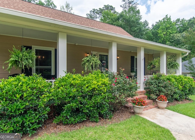 7 Stonehaven Dr, Newnan, GA 30265 - view of exterior entry featuring a porch and a shingled roof