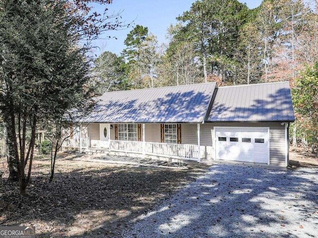 view of front of house featuring covered porch and a garage