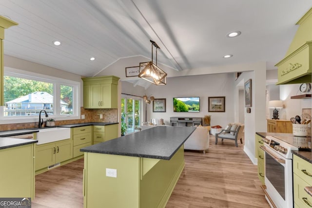 kitchen featuring light hardwood / wood-style floors, white range with electric stovetop, green cabinets, and vaulted ceiling