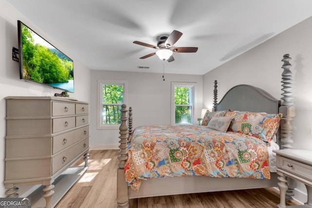 bedroom featuring light hardwood / wood-style flooring and ceiling fan