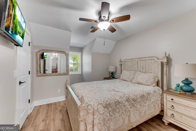 bedroom with lofted ceiling, light wood-type flooring, and ceiling fan