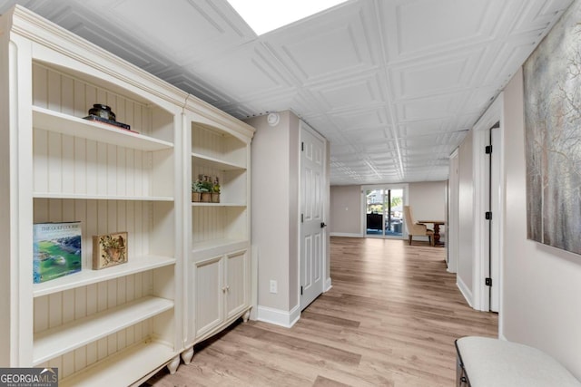 hall with light hardwood / wood-style flooring