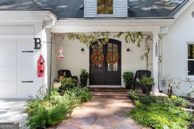 property entrance with covered porch and a garage