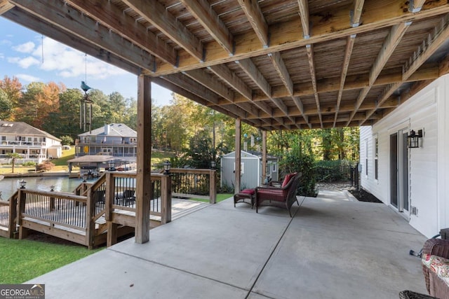 view of patio with a storage shed