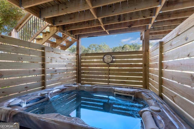 view of pool featuring a hot tub