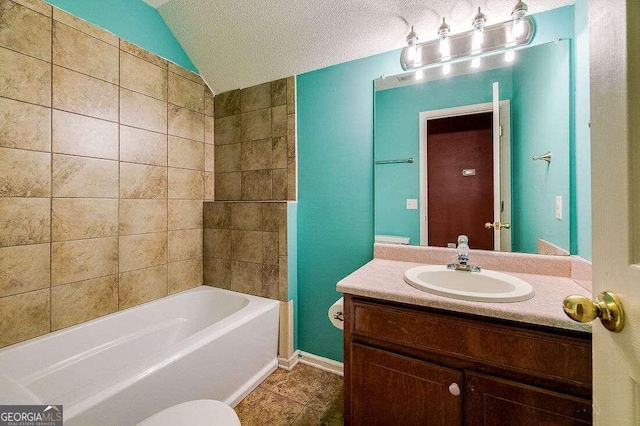 full bathroom with lofted ceiling, tile patterned floors, toilet, vanity, and a textured ceiling