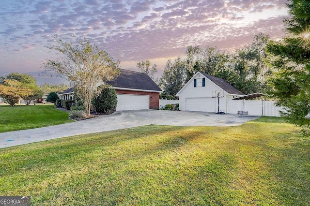 view of front of house with a yard and a garage