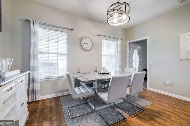 dining room with dark wood-type flooring