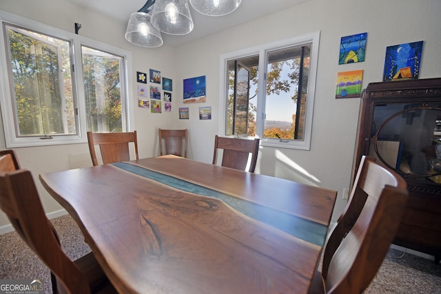 view of carpeted dining space