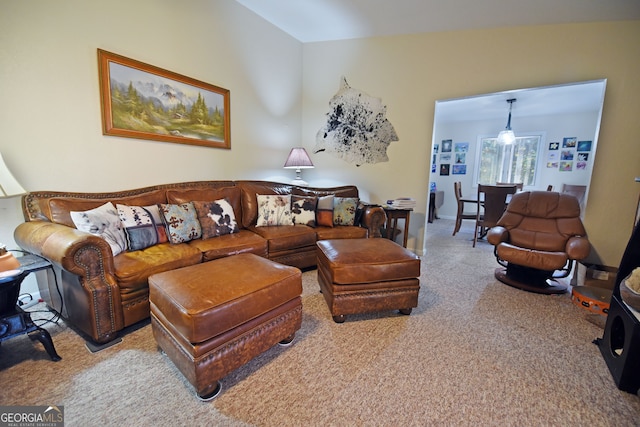 living room with light carpet and vaulted ceiling