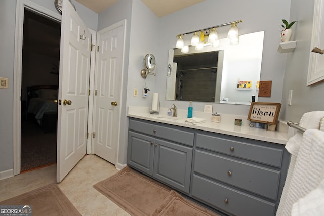 bathroom with vanity, a shower, and tile patterned floors