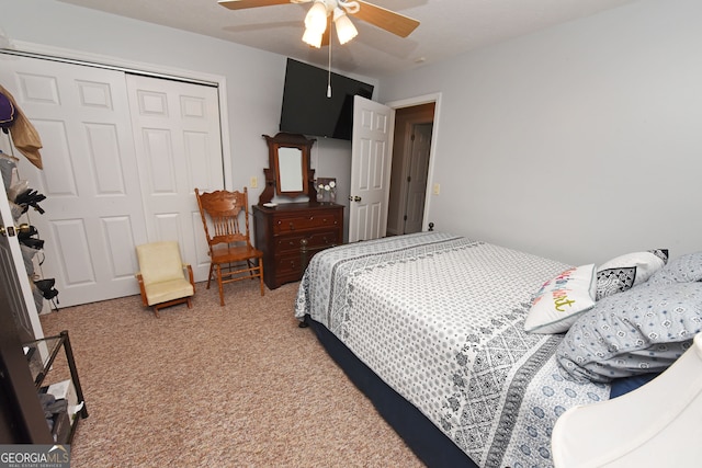 bedroom featuring a closet, light colored carpet, and ceiling fan