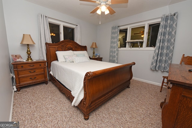 bedroom featuring light carpet and ceiling fan