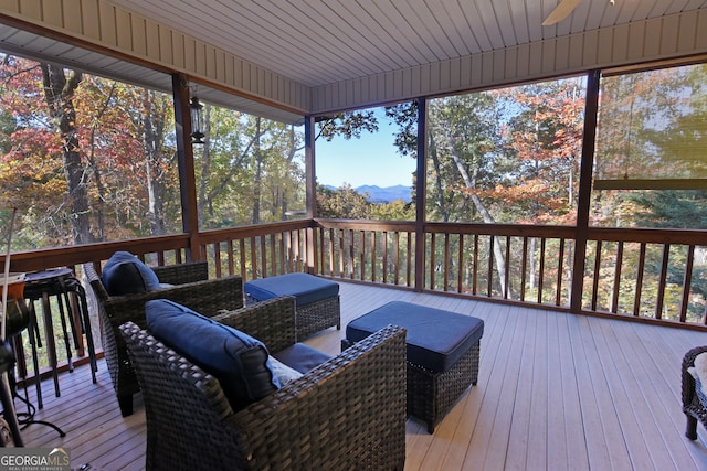 sunroom / solarium featuring wood ceiling